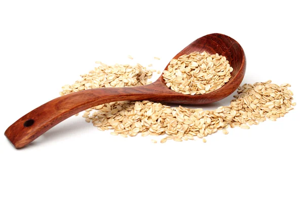 Oat flakes pile in spoon — Stock Photo, Image