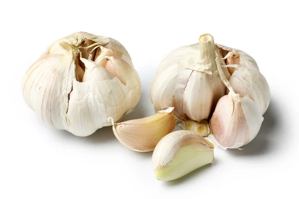 Garlic bulbs with clovers — Stock Photo, Image