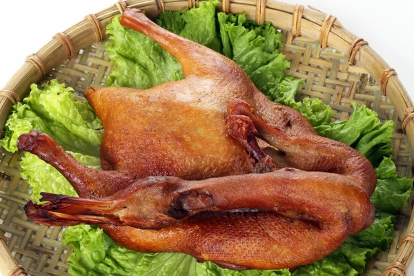 Duck on fresh salad leaf — Stock Photo, Image