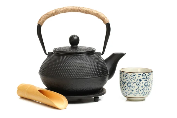 Cast-iron pot with cup — Stock Photo, Image