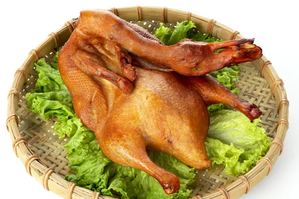 Duck on fresh salad leaf — Stock Photo, Image