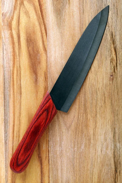 Knife on cutting board — Stock Photo, Image