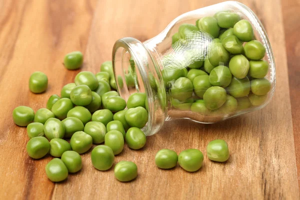 Fresh peas in bottle — Stock Photo, Image