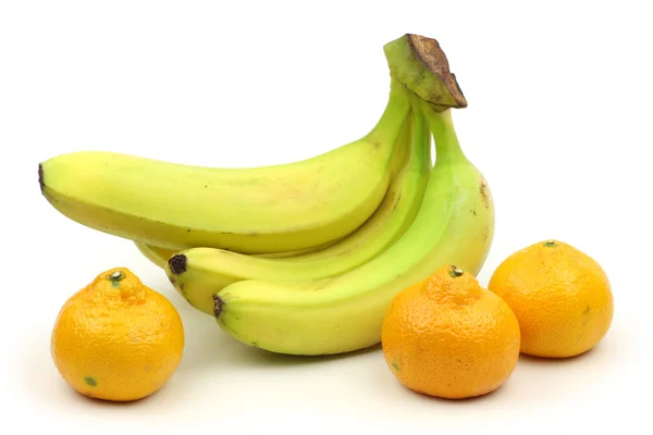 Bananas with mandarines — Stock Photo, Image