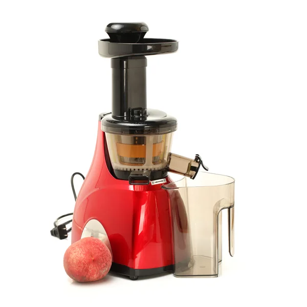 Juicer lento com pêssego — Fotografia de Stock