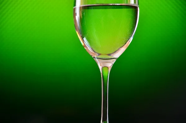 Glass on a green background — Stock Photo, Image