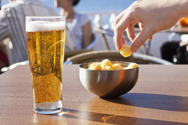 Eating snacks with beer. — Stock Photo, Image