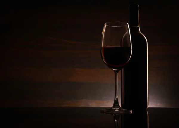 Bottle and glass with red whine — Stock Photo, Image