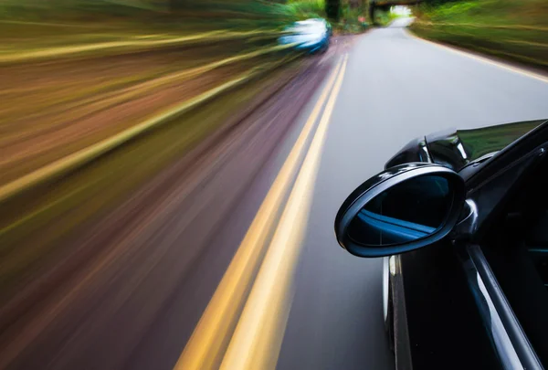 View of black luxury sedan driving fast. — Stock Photo, Image