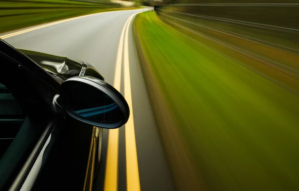 View of black luxury sedan driving fast. — Stock Photo, Image