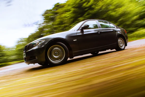 View of Luxury sedan with blurred motion. — Stock Photo, Image