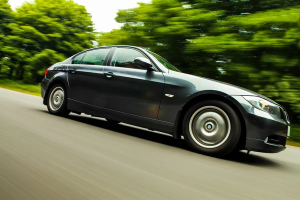 View of Luxury sedan with blurred motion. — Stock Photo, Image
