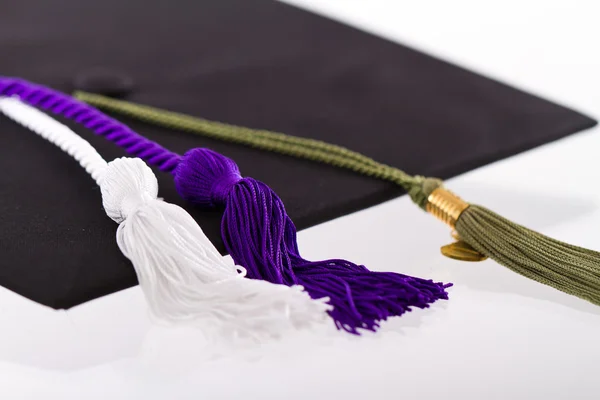 Tapa y cordones, símbolos de logro y educación — Foto de Stock