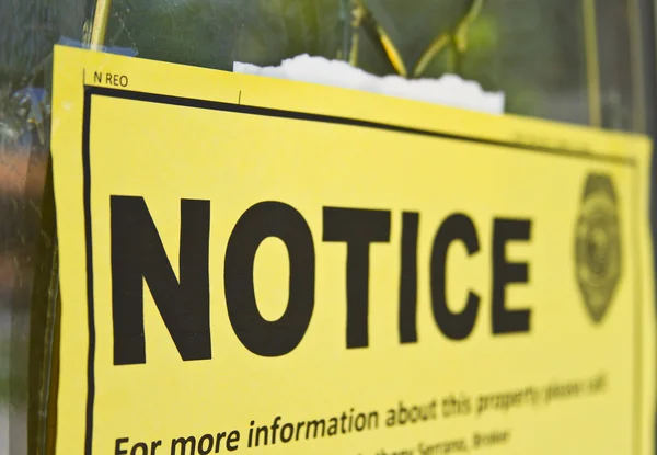 Notice sign posted on a condemned house door — Stock Photo, Image