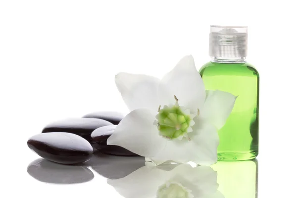 Spa items - liquid soap, stones and flower — Stock Photo, Image