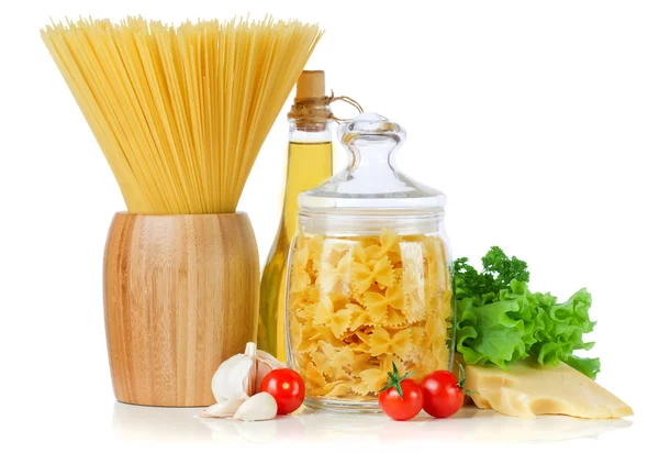 Pasta spaghetti, vegetables and spices and oil isolated on white Stock Image