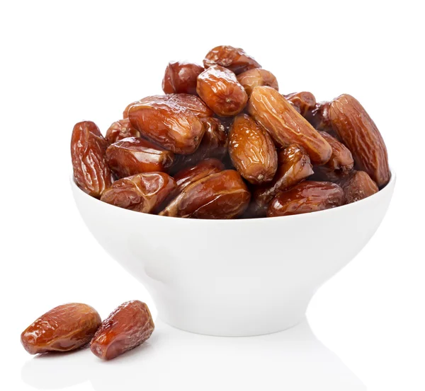 Dates fraîches dans un bol isolé Images De Stock Libres De Droits