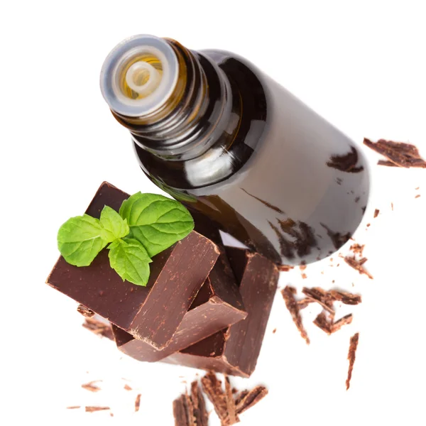 Essential oil essential and chocolate with mint leaves isolated — Stock Photo, Image
