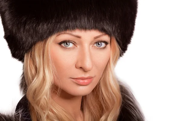 Portrait of beautiful woman in a fur hat — Stock Photo, Image