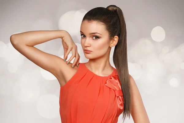 Young female with healthy straghit brown hairs put in pony tail. — Stock Photo, Image