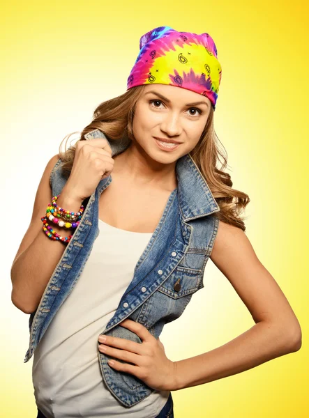 Portrait of cute girl in jeans vest and bandana — Stock Photo, Image