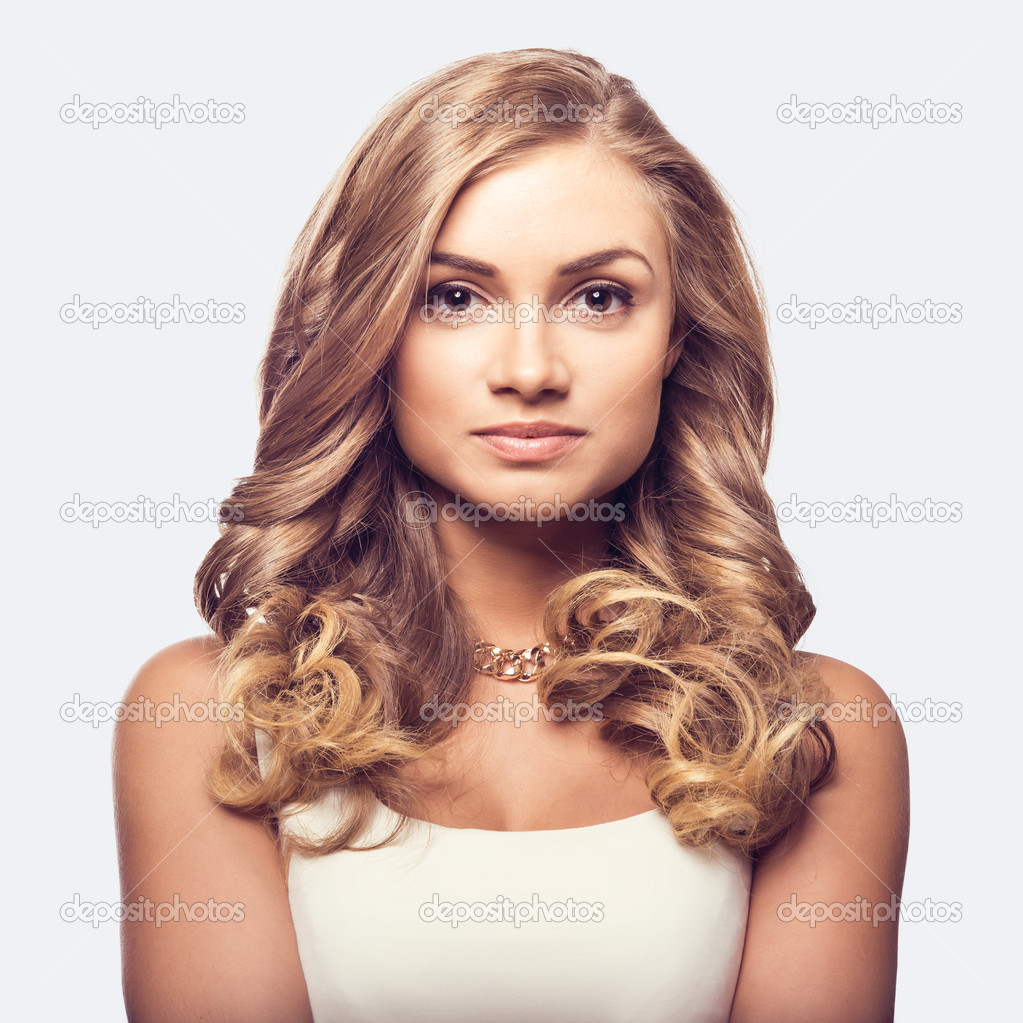 Cute blonde woman with long curly hairs
