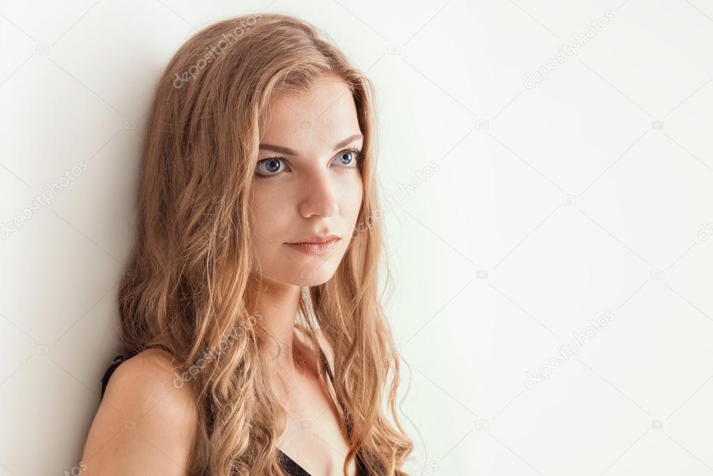 studio shot portrait of a young beautiful blonde woman
