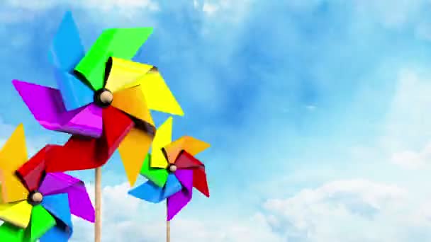 Pinwheels giratorios de colores en el cielo — Vídeo de stock