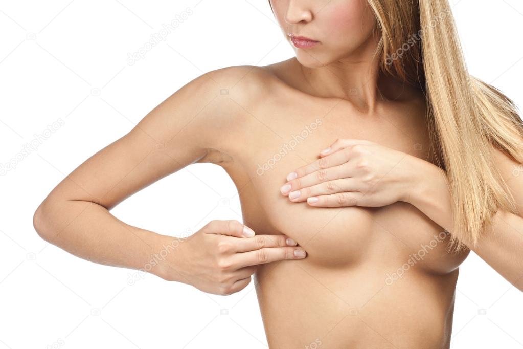 Woman examining her breast