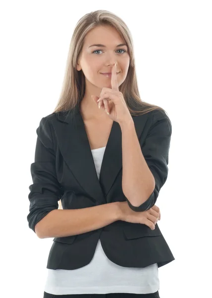 Portrait of pretty young businesswoman with finger on lips — Stock Photo, Image