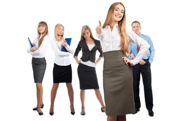 Happy business woman with colleagues standing in the background Royalty Free Stock Photos