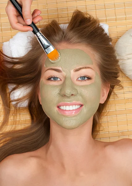 Woman with clay facial mask — Stock Photo, Image