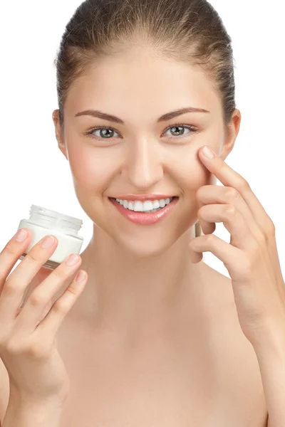 Beautiful woman applying moisturizer cream — Stock Photo, Image