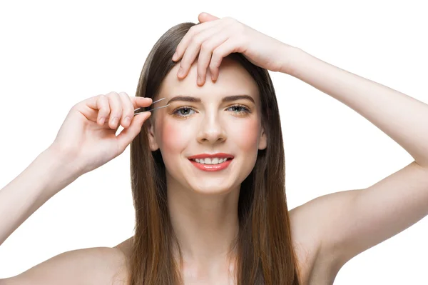 Mujer arrancándose las cejas — Foto de Stock