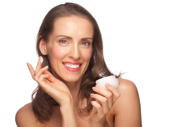 Woman applying moisturizing cream — Stock Photo, Image