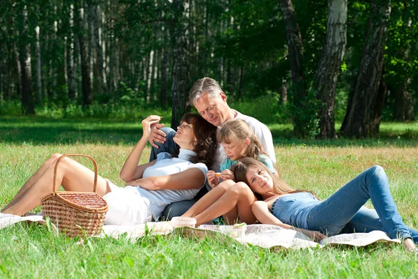 Happy family having picnic — Stock Photo, Image