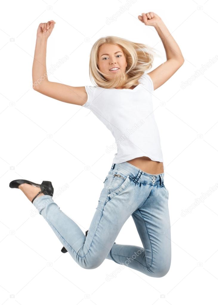 Pretty young woman jumping in air