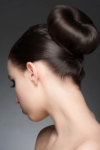 Brunette with elegant hairstyle Stock Photo by ©Dragonfly666 41999591