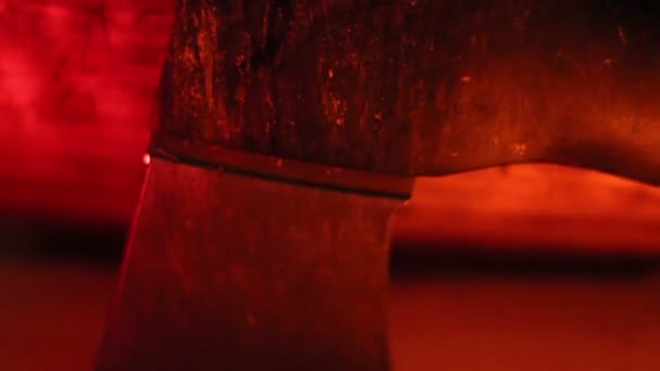 The axe under a red-lighted room — Stock Video