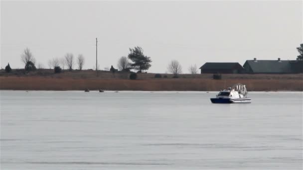 Blue boat on snow with red light — Stock Video