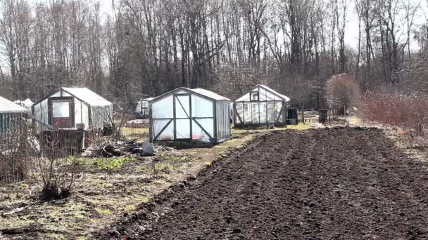 Some greenhouse on the field — Stock Video