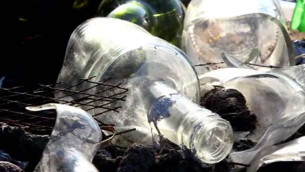 Some broken bottles on the garbage area — Stock Video