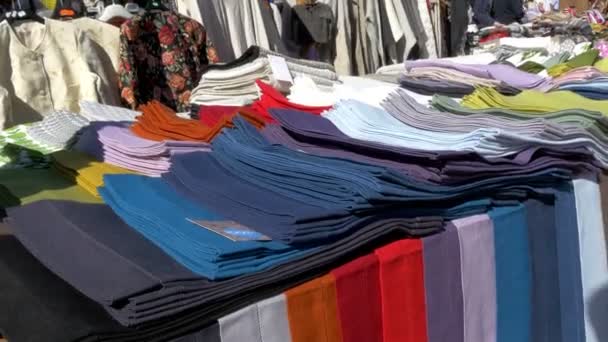 Colorful clothes being displayed on the street of Estonia GH4 UHD — Stock Video