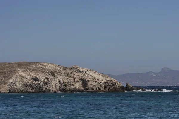 Cliff with sea in foreground delos greece — Stock Photo, Image