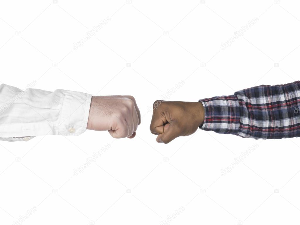 Two hands making fist bump