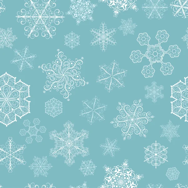 Patrón sin costuras de Navidad con copos de nieve grandes y pequeños — Archivo Imágenes Vectoriales