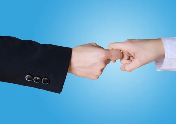 Two business hands in rivalry, blue background — Stock Photo, Image