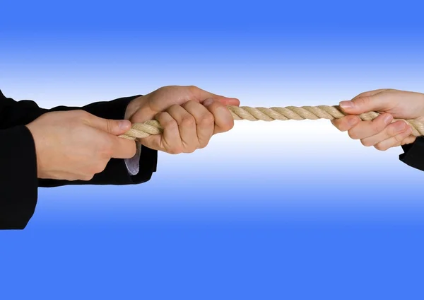 Tug of war with blue background — Stock Photo, Image