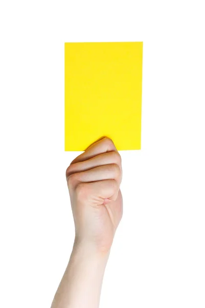 Mano che tiene un cartellino giallo — Foto Stock