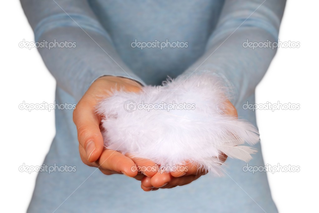 hands holding feathers